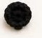 Small black crocheted nose piece, a rounded dome made from a magic ring and one increase round