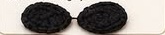 Two flat black crocheted eye mask ovals, made from a foundation chain instead of a magic ring