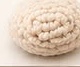 Small flat cream crocheted muzzle piece, ready to be sewn between the eyes and embroidered
